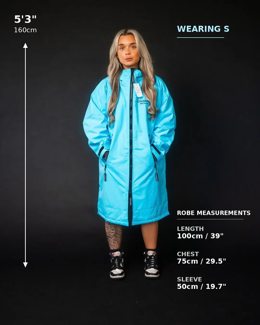 A model wearing a bright blue COLDWATERCO robe stands against a black background with measurement text and labels showing the robe's dimensions. White text on the image reads 'WEARING S' and 'ROBE MEASUREMENTS' with length, chest, and sleeve measurements listed below.