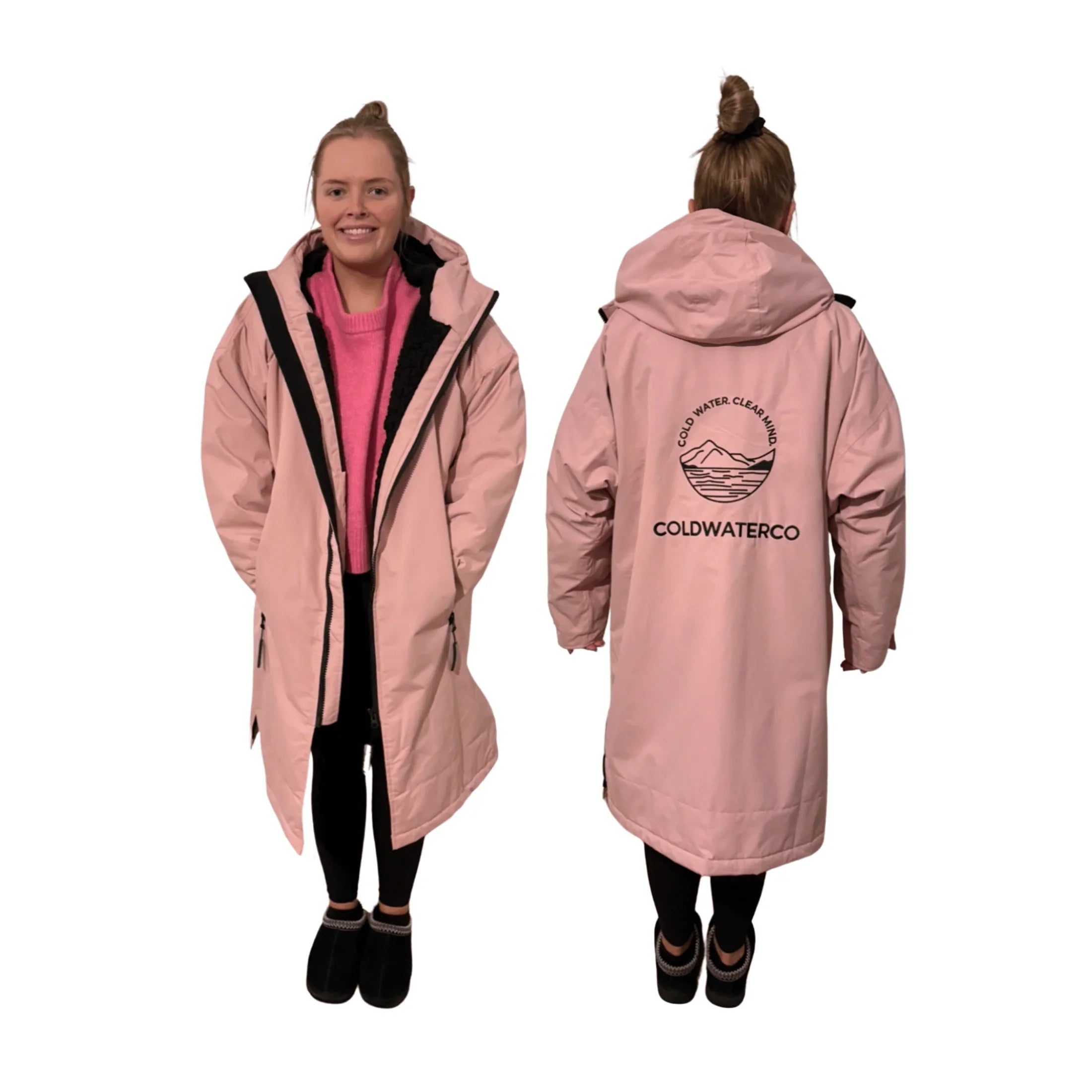 Woman wearing pink changing robe against white background