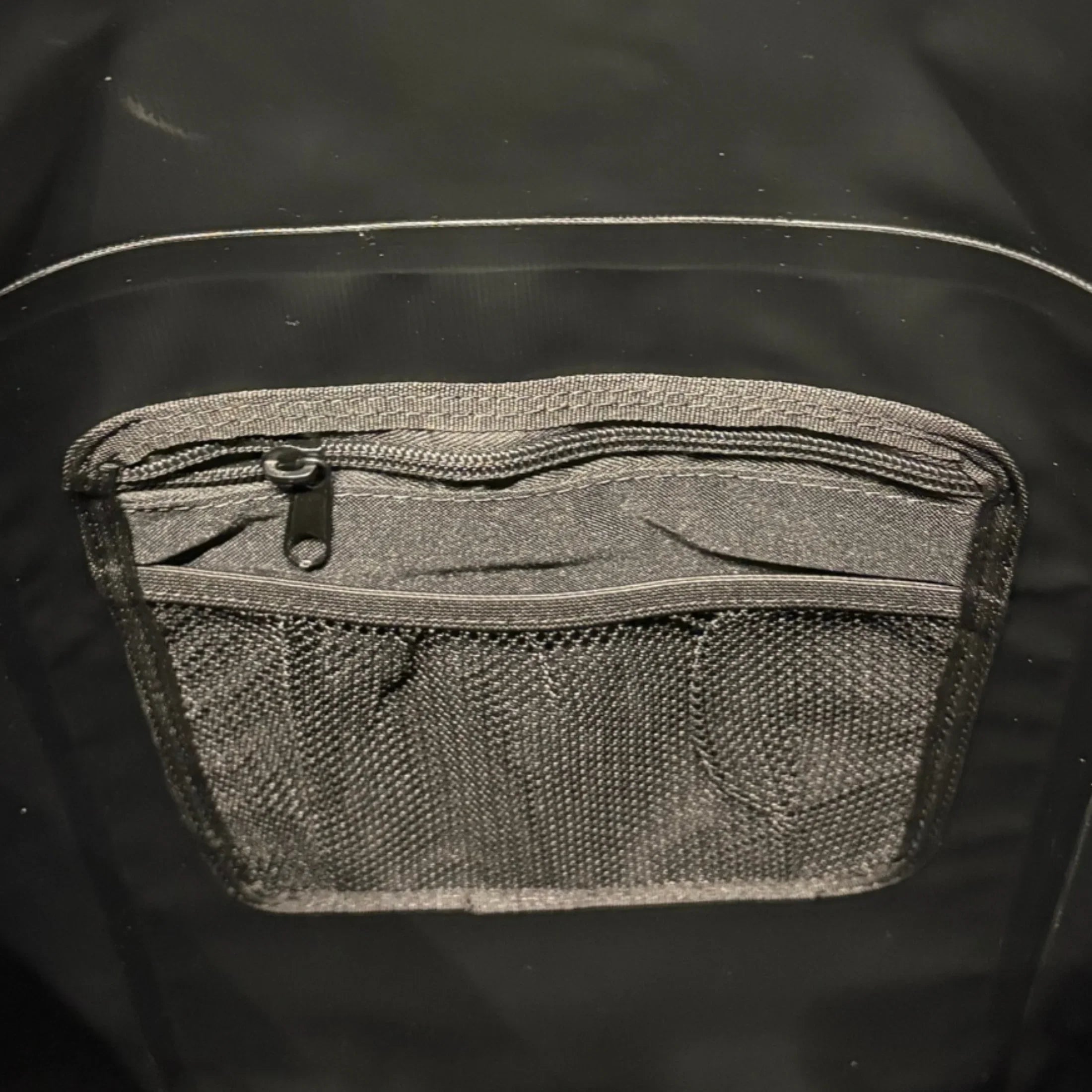 Black waterproof backpack inside pocket view