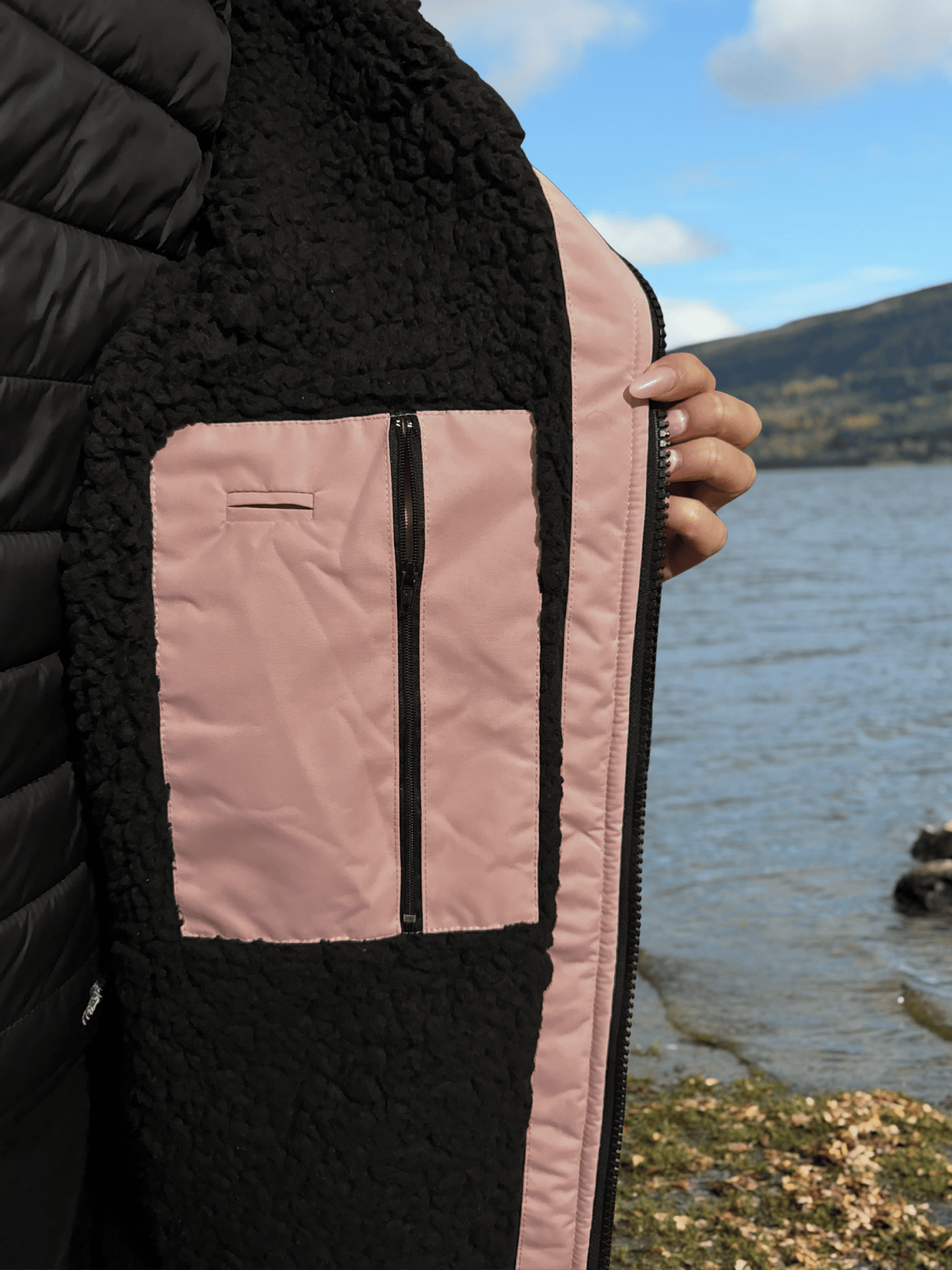 Inside detail of zip and pocket of pink changing robe