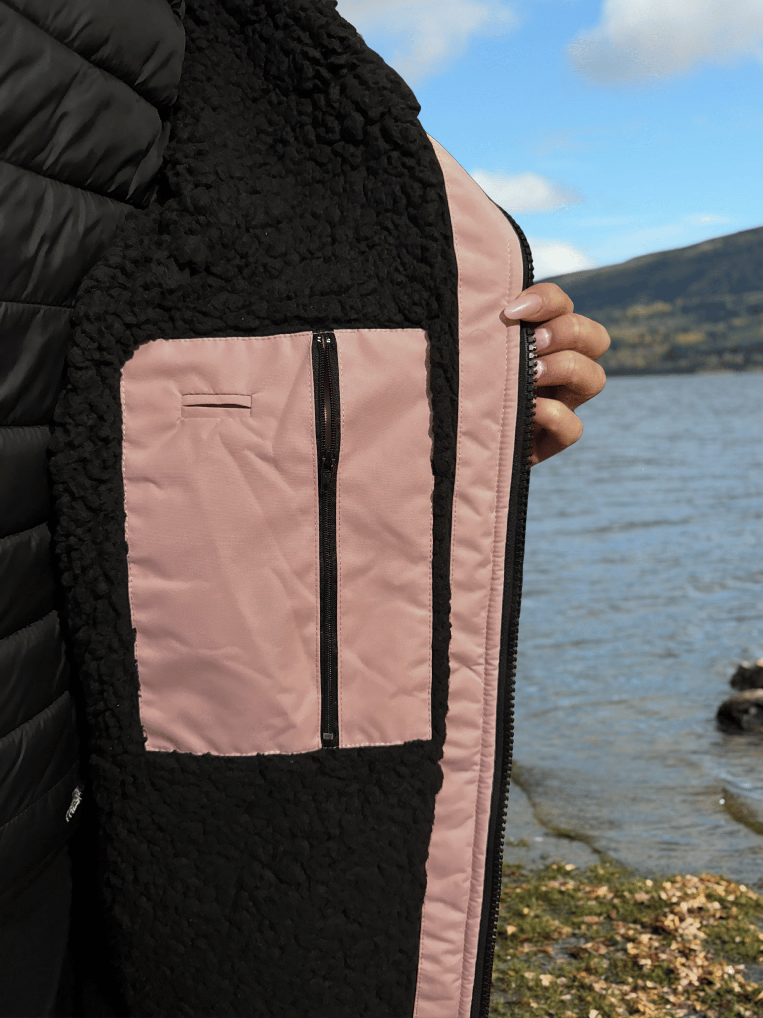 Inside detail of zip and pocket of pink changing robe