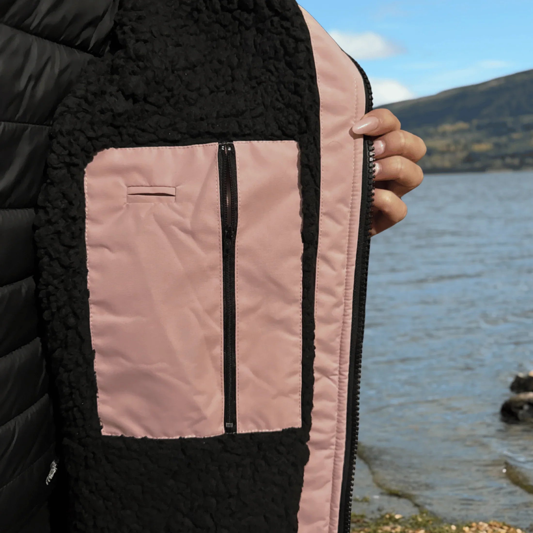 Inside detail of zip and pocket of pink changing robe