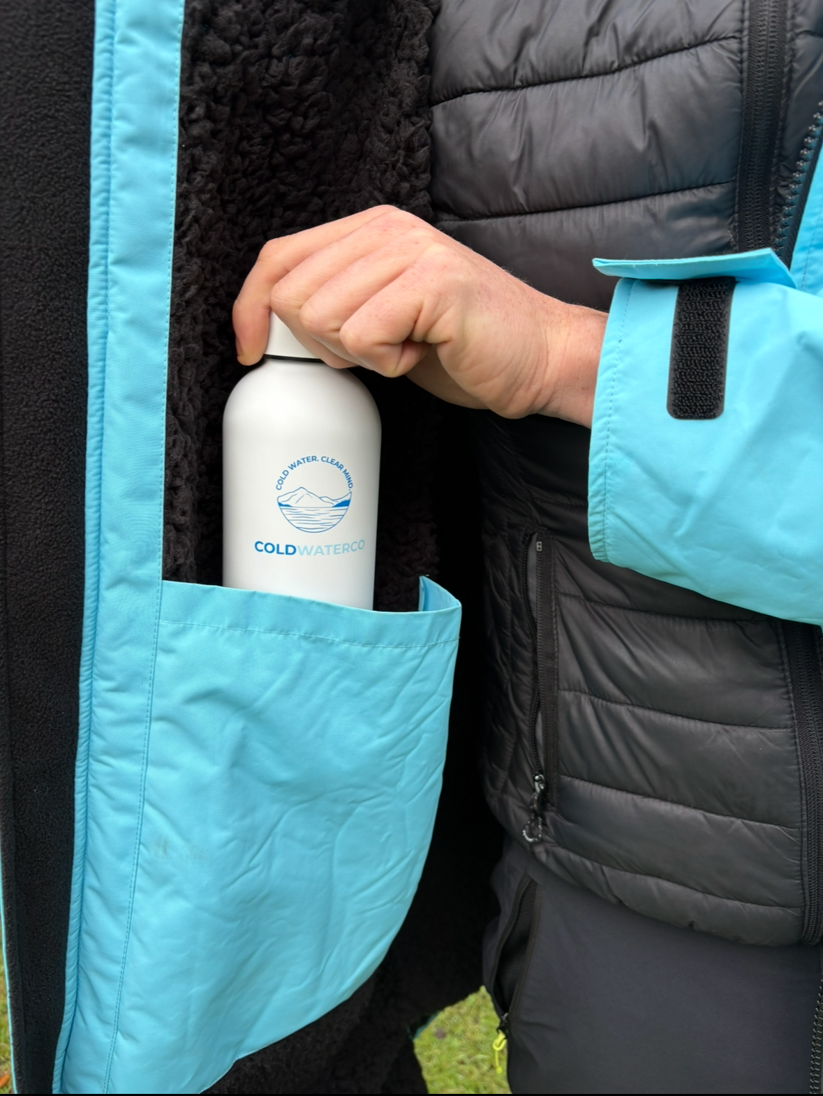 Inside detail of blue changing robe showing fleece and inside pocket