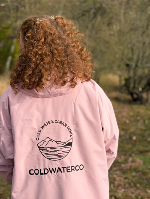 Woman in pink robe, showing back detailing