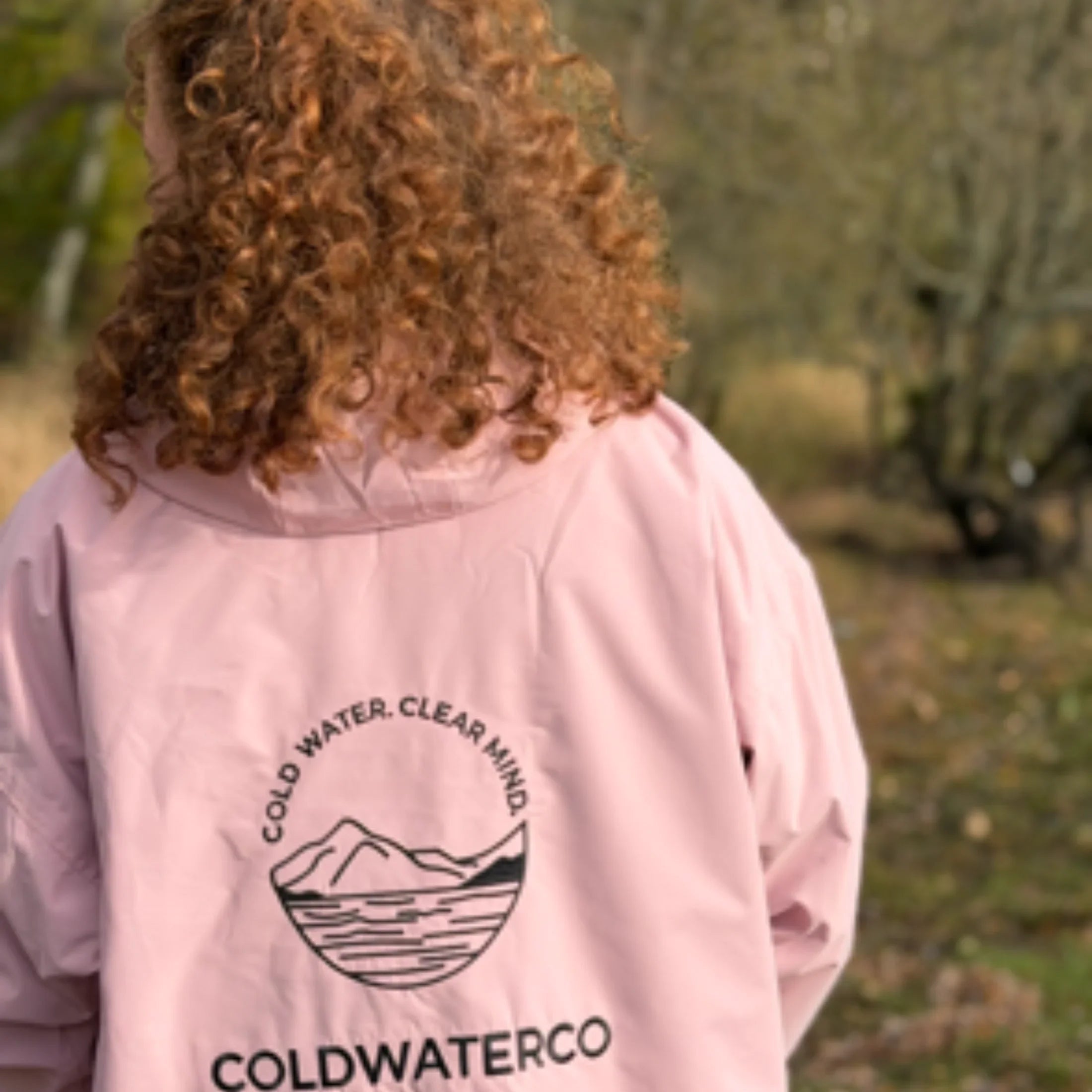 Woman in pink robe, showing back detailing