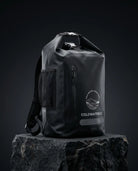 Black waterproof backpack with a visible brand logo(ColdWaterCo) on a dark background