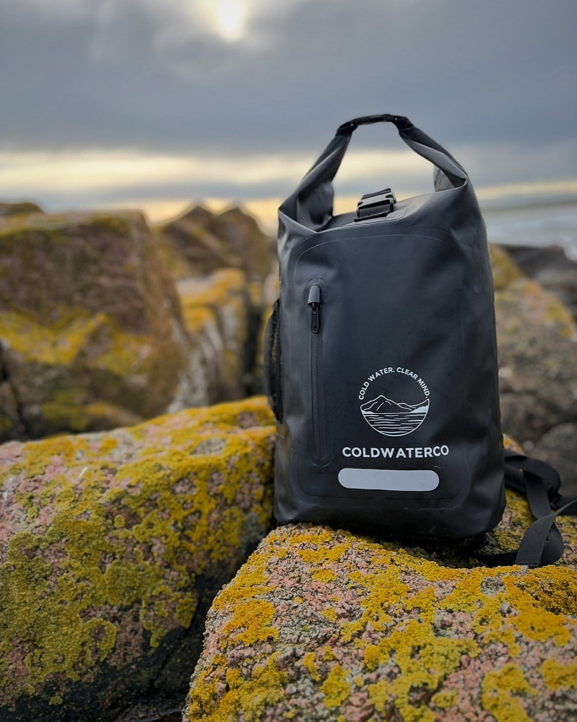 Black waterproof backpack shown outdoors