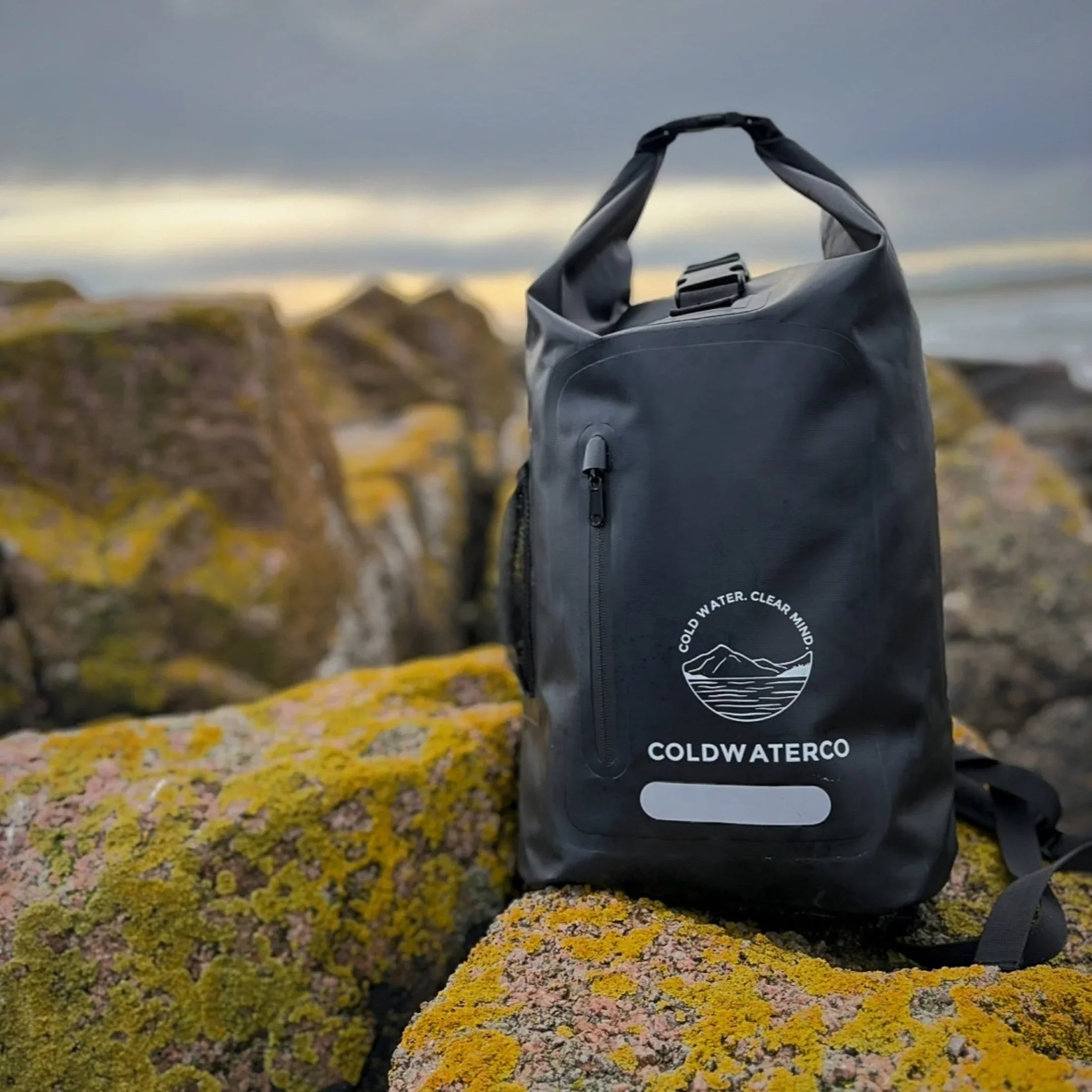 Black waterproof backpack shown outdoors