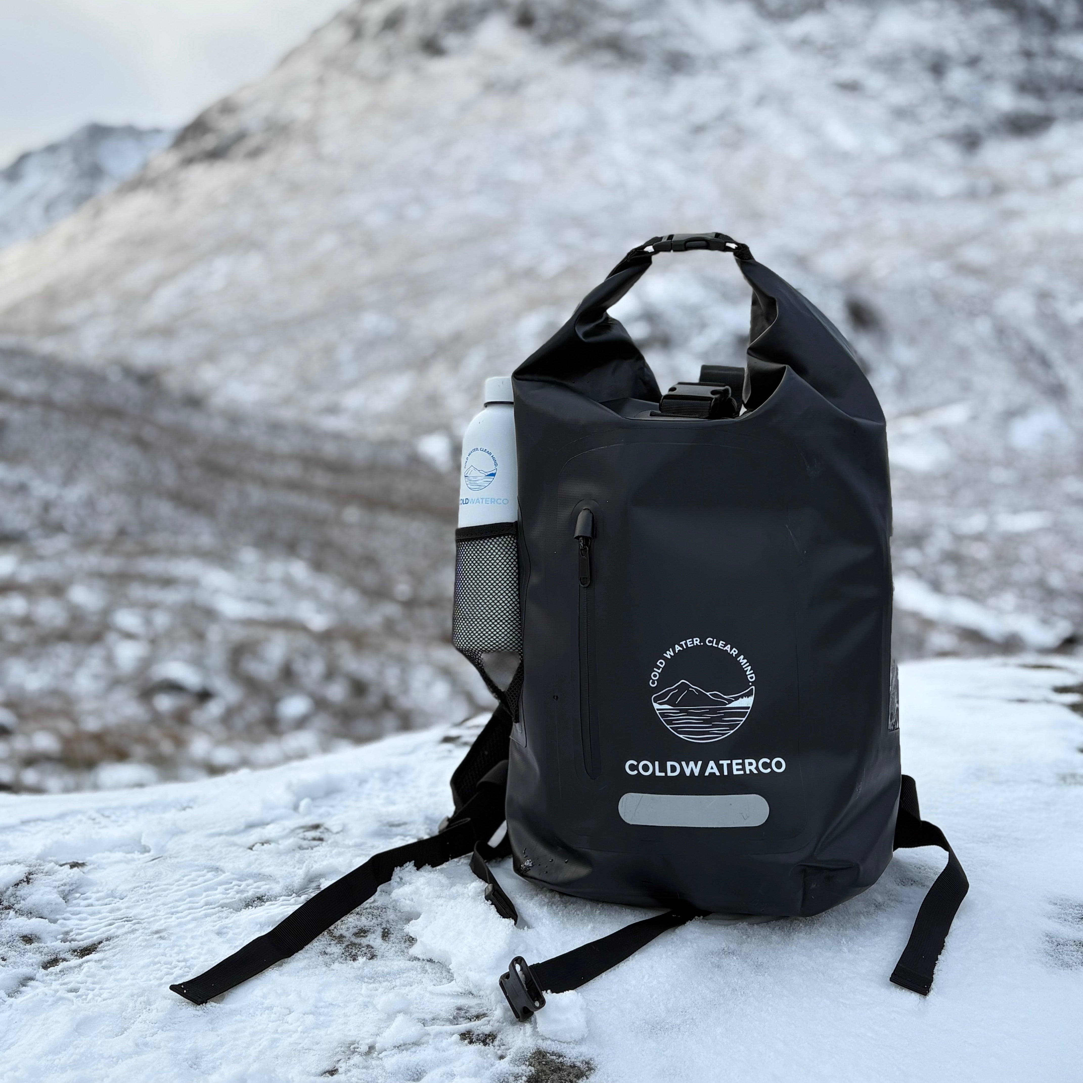 Black backpack with 'COLDWATERCO' logo on a snowy ground