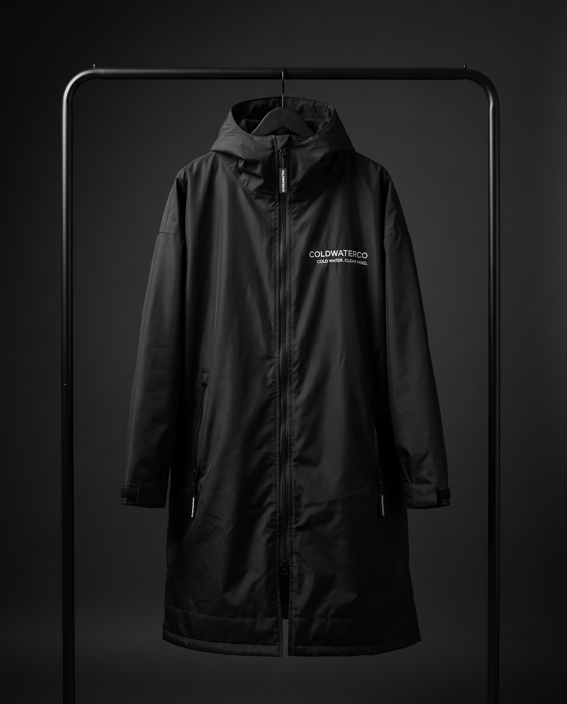 Black coat with a brand logo on a dark background
