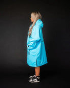 Lady in blue ColdWaterCo changing robe studio photo