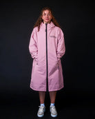 Lady in pink ColdWaterCo changing robe, studio photograph